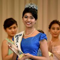 Priyanka Yoshikawa smiles as she holds the trophy after winning the Miss Japan title during the Miss World Japan 2016 Beauty Pageant in Tokyo on Monday. The half-Indian 22-year-old model won the title to represent Japan in the Miss World 2016 contest. | AFP-JIJI