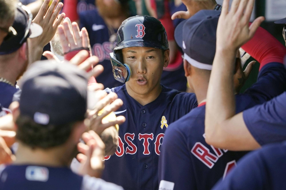 Masataka Yoshida of the Boston Red Sox walks back to the dugout after  News Photo - Getty Images