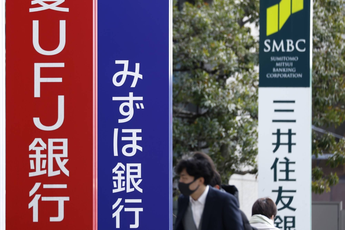 Banks boom and shoppers scrimp a year after Japan’s rate pivot