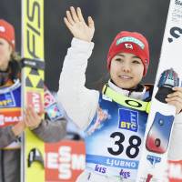 Sara Takanashi waves to the crowd after finishing third at a World Cup ski jumping event in Ljubno, Slovenia, on Saturday. | KYODO