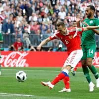 Denis Cheryshev scores Russia\'s second goal over Saudi Arabia in the opening game Thursday in Moscow. Russia won 5-0. | REUTERS