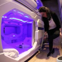 An employee shows a room before the opening of the first hotel with sleeping capsules in the Balkans, in Ljubljana Tuesday. | REUTERS
