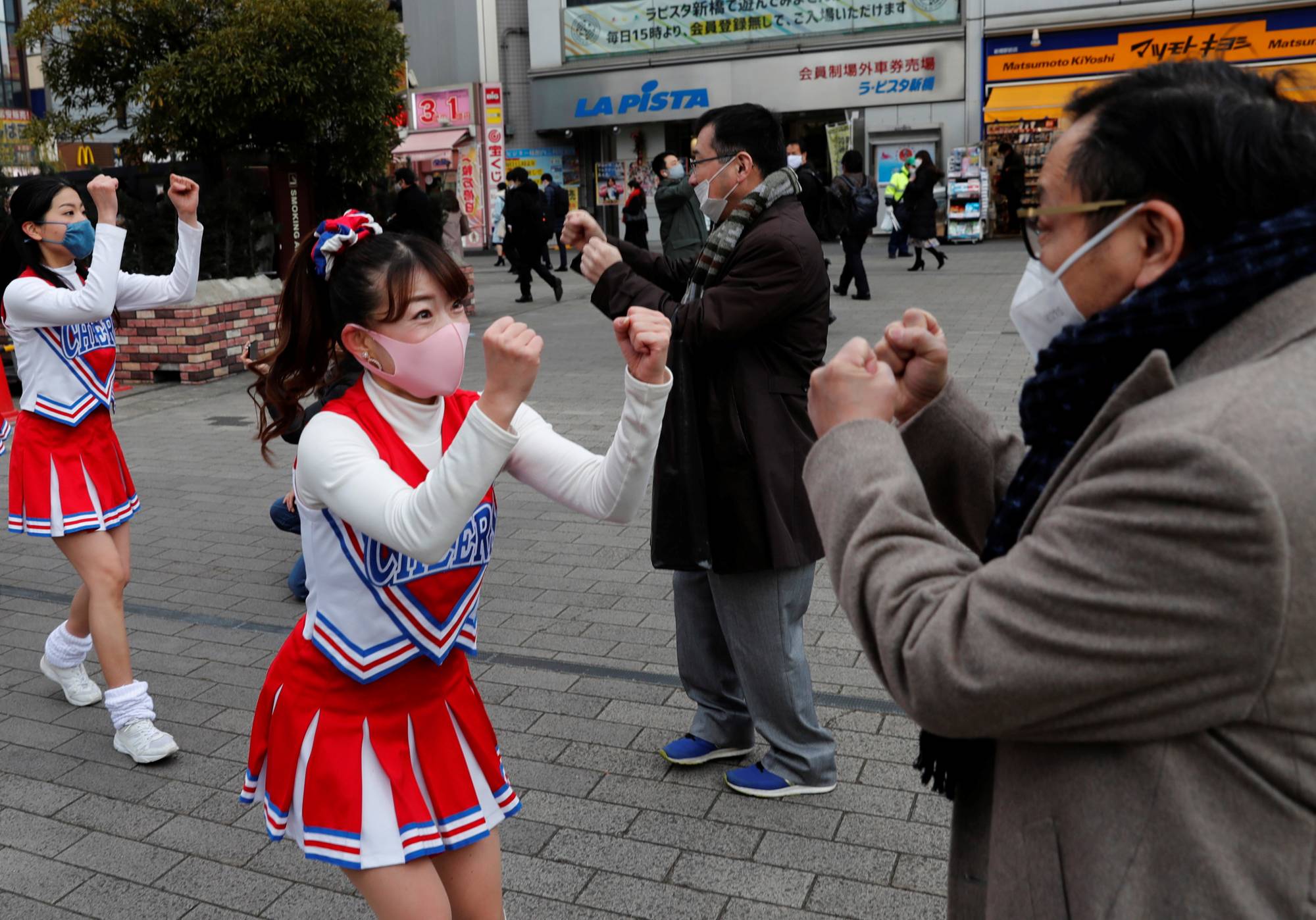 Cheerleaders lift Tokyo's spirits as coronavirus cases surge - The Japan  Times
