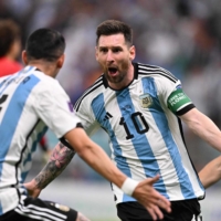 Lionel Messi and Argentina celebrate after defeating the