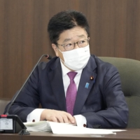 Health minister Katsunobu Kato attends a meeting of a COVID-19 expert panel in Tokyo on Wednesday. | KYODO