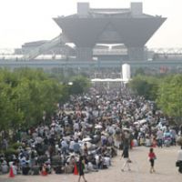 Fans of manga comic throng the sidewalks leading up to the Tokyo Big Sight awaiting to enter the Comic Marker expo. The 33-year-old event is acknowledged as the birthplace of Japan\'s cosplay (costume play) phenomena. | COMIC MARKET PREPARATIONS COMMITTEE