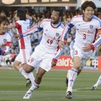 Masato Morishige (second from right) smiles Sunday after scoring a goal in the 87th minute and giving FC Tokyo a 1-0 win over Kawasaki Frontale. | KYODO PHOTO