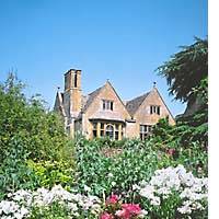 Set on a windy hillside in Gloucestershire, western England, 17th-century Hidcote Manor -- shown behind banks of stocks and old-fashioned roses -- was bought in 1907 by a wealthy American whose son transformed its grounds into a remarkable \"labyrinth of nearly 30 different gardens.\" | &#160; PHOTOS AND GRAPHICS COURTESY OF JOEL ANDREAS