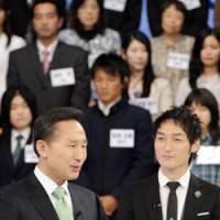 Catch them young: South Korean President Lee Myung Bak shares a light moment Monday with TV celebrity Tsuyoshi Kusanagi on a talk show with more than 100 young people. | AP