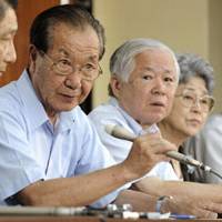 Voice of caution: Shigeo Iizuka, who represents an association of Japanese whose kin were abducted by North Korea in the 1970s and 1980s, faces reporters with other members Thursday in Tokyo. | KYODO PHOTO