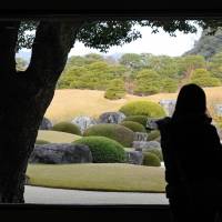 Visual art: Visitors admire the Japanese garden at the Adachi Museum of Art in Yasugi, Shimane Prefecture, on Tuesday. It was selected as the best Japanese garden by a U.S. magazine for the ninth consecutive year. | KYODO