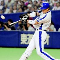 See ya!: Chunichi Dragons outfielder Lee Byung Kyu hits a two-run homer in the sixth inning against the Hiroshima Carp at Nagoya Dome on Thursday. The Dragons won 7-0. | KYODO PHOTO