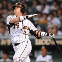 Big hit: Tigers catcher Kenji Johjima clubs a solo home run in the fourth inning against the the Dragons on Friday at Koshien Stadium. Hanshin beat Chunichi 3-2. | KYODO PHOTO