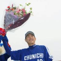 Chunichi Dragons pitcher Hitoki Iwase celebrates Sunday after posting his 286th save in a game against the Rakuten Eagles. The save tied Iwase with former Yakult Swallows closer Shingo Takatsu for the Japanese all-time record. | KYODO PHOTO