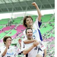JEF United Chiba\'s Satoru Yamagishi celebrates with teammate Mario Haas after scoring against Cerezo Osaka during their Nabisco Cup quarterfinal match on Sunday. | KYODO PHOTO