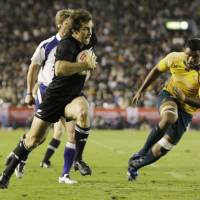 Pay dirt: New Zealand\'s Conrad Smith scores a try against Australia during their Bledisloe Cup match at National Stadium on Saturday. The All Blacks defeated the Wallabies 32-19. | AP PHOTO