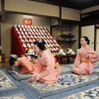 Season\'s greetings: A geisha meets with Inoue Yachiyo (left), a master of the Kyomai dance school, during the \"kotohajime\" event signaling the start of their preparations for New Year\'s in Kyoto on Monday. | KYODO PHOTO