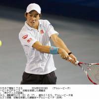 Solid start: Kei Nishikori hits a return against Gastao Elias in the Delray Beach Open on Wednesday. Nishikori won 6-1, 5-7, 6-2. | KYODO