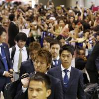 We\'re back: The Samurai Blue arrive at Narita on Friday. | KYODO