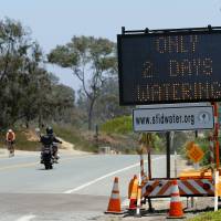Hollywood dries up: A road sign warns residents heading into Rancho Santa Fe, California, of water restrictions for their yards due to the continuing drought, reflecting a turn toward parched, apocalyptic U.S. science fiction films being produced recently.  | REUTERS/MIKE BLAKE