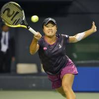 Kurumi Nara hits a return to Karolina Pliskova during their second-round Pan Pacific Open match on Thursday at Ariake Tennis Forest Park. Pliskova won 6-2, 6-4. | KYODO