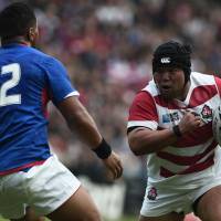 Japan prop Kensuke Hatakeyama runs with the ball during Saturday\'s win over Samoa at the Rugby World Cup. | AFP-JIJI