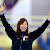 Misaki Oshigiri waves to the crowd after her victory in a World Cup mass start event on Sunday. | KYODO