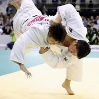 Judoka Hisayoshi Harasawa (right) competes against Ryu Shichinohe in the men\'s over 100-kg division final at the National Weight Category Championships  on Saturday at Fukuoka Kokusai Center. | KYODO