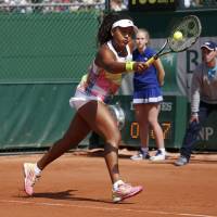 Naomi Osaka plays a shot during her second-round win over Croatia’s Mirjana Lucic-Baroni at the French Open in Paris on Wednesday. | REUTERS