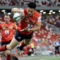 The Sunwolves\' Akihito Yamada dives to score a try against the Cheetahs during a match on March 12, 2016 in Singapore. | AP