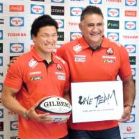 Harumichi Tatekawa (left), standing alongside new Japan rugby coach Jamie Joseph during a Friday news conference, will be a co-captain for the November test series against Argentina. Joseph named 17 uncapped players to the 32-man squad. | KYODO