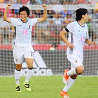 Japan\'s Mami Ueno (left) celebrates her goal against the United States during a Women\'s U-20 World Cup match on Saturday in Port Moresby. | FIFA / VIA GETTY / KYODO