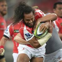 The Sunwolves\' Liaki Moli is tackled by Andisa Ntsila of the Southern Kings during their match on Saturday in Singapore. | AP