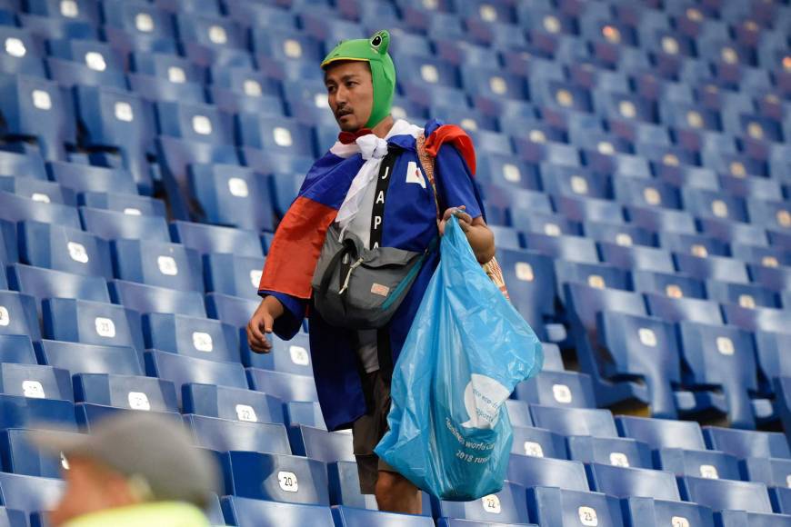 A Japan supporter collects garbage after the 2018 World Cup round of 16 soccer match between Belgium and Japan at the Rostov Arena in Rostov-On-Don, Russia, on Monday.