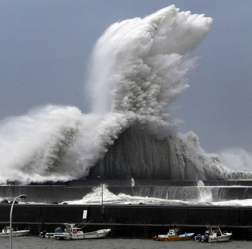 High waves break over a concrete wall at a fishing port in Aki, Kochi Prefecture, on Tuesday as Typhoon Jebi approached western Japan.