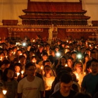 People take part in a candlelight vigil at Victoria Park in Hong Kong on June 4, 2019 to commemorate the protesters killed in Tiananmen Square 30 years before. | LAM YIK FEI / THE NEW YORK TIMES