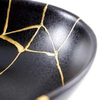 Kintsugi is a technique for mending broken pottery with melted gold. | GETTY IMAGES