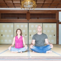 Temple guests participate in meditation sessions. | GETTY IMAGES