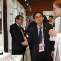 German Minister of Education and Research Bettina Stark-Watzinger (right) interacts with OriHime, an avatar robot that is controlled by people with disabilities or conditions that prevent them from going out or working regularly. | KERRY FURUKAWA