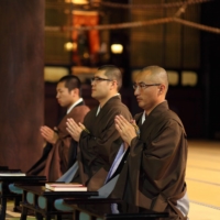 Buddhist monks spend much of their day praying. | GETTY IMAGES