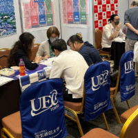 University staff members participate in a Study in Japan Fair held abroad in August. | UEC