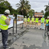 Japanese and Cambodian representatives conduct a final inspection of National Road No. 5 in Kampong Chhnang province in November 2022. | SUMITOMO MITSUI CONTSRUCTION CO.