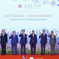 Prime Minister Fumio Kishida (fifth from left) and his counterparts from the Association of Southeast Asian Nations pose for a group photo at the beginning of the Japan-ASEAN summit on Nov. 12, 2022, in Phnom Penh. | POOL PHOTO / KYODO