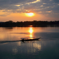 The sun rises above the Mekong River in Don Khong, Laos. | GETTY IMAGES