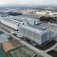 Taiwan Semiconductor Manufacturing Co.’s first plant in Kumamoto Prefecture, run by TSMC subsidiary Japan Advanced Semiconductor Manufacturing Inc., is in the town of Kikuyo. At the upper right is Sony Semiconductor Manufacturing Corp.’s Kumamoto Technology Center. | JIJI