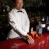 Kazuya Morisaki offers his original Tefu Tefu cocktail to a guest after winning Suntory The Cocktail Award 2024. | SUNTORY SPIRITS LTD.