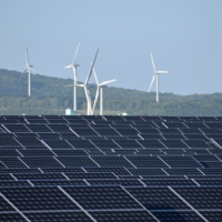 Solar panels and wind turbines in the village of Rokkasho, Aomori Prefecture, in May | JIJI