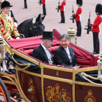 Emperor Naruhito chats with King Charles III as their carriage arrives at Buckingham Palace in London on June 25.  | JIJI